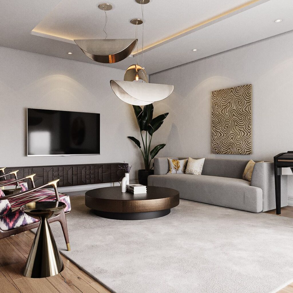 Modern afrocentric living room with traditional art, taco-shaped lights, solid wood media console and round layered metallic coffee table.