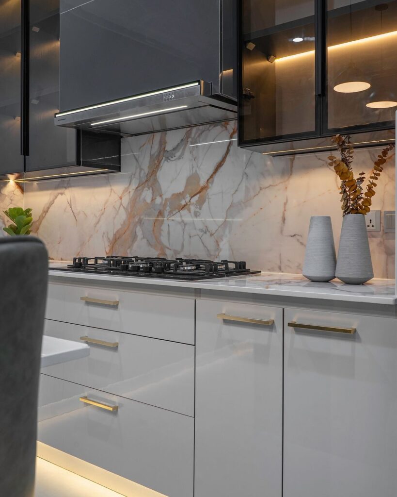 Image of a contemporary kitchen featuring marble countertops.