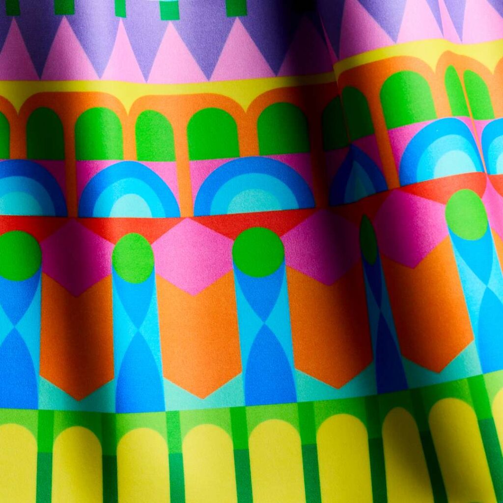 Yinka Ilori x Momentum - Rhythms Surround You, an exuberant stripe stacking multiple arches.