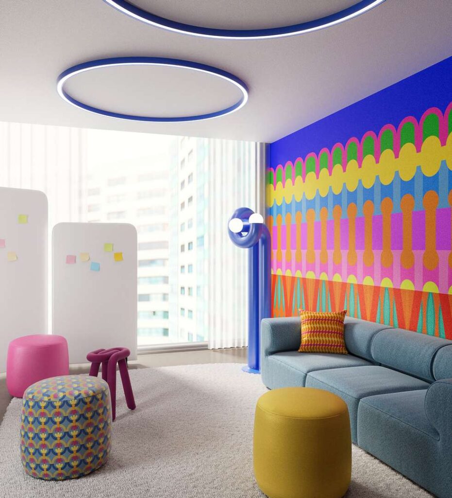 A vibrant room with a colorful wall and furniture in various shades, creating a lively and energetic atmosphere.