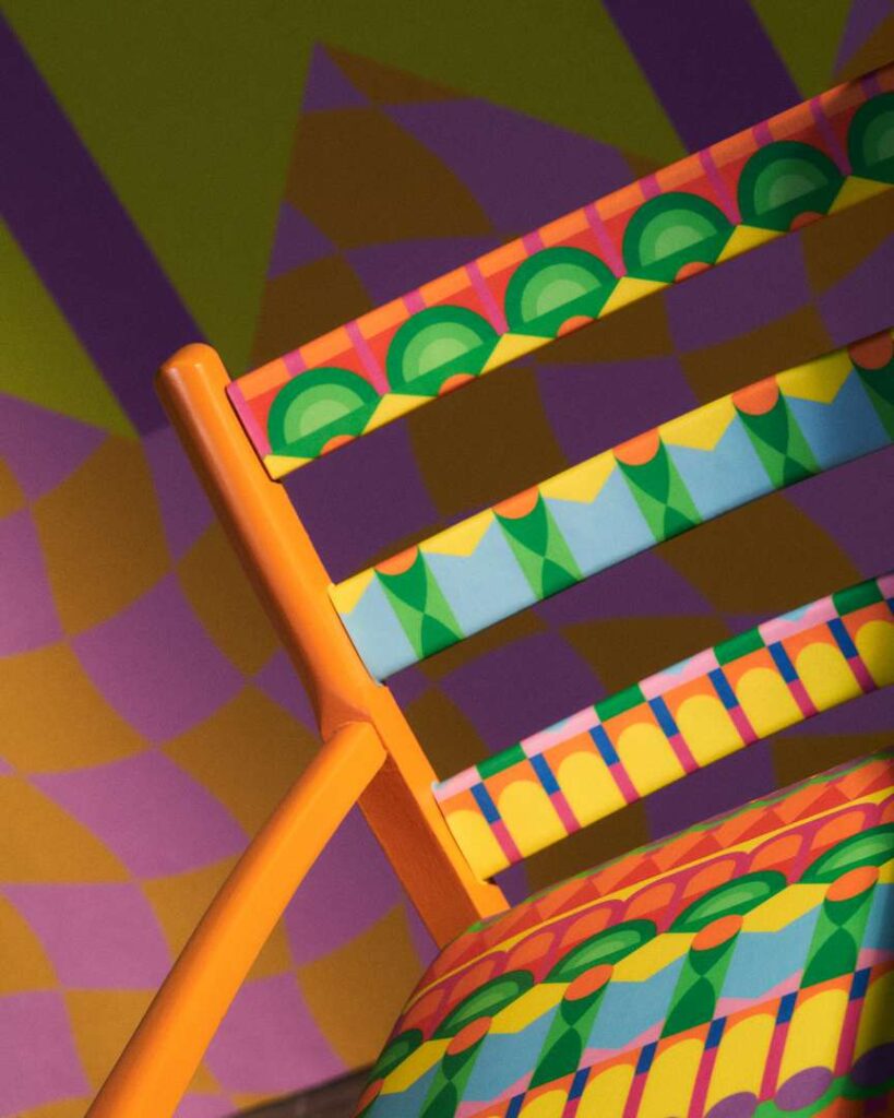 A vibrant chair with a decorative pattern, adding color and style to any space.