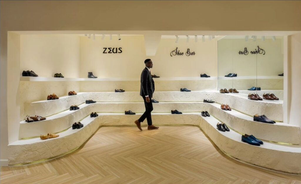 Tiered shoe display in shoe bar at Zeus menswear store in Lagos