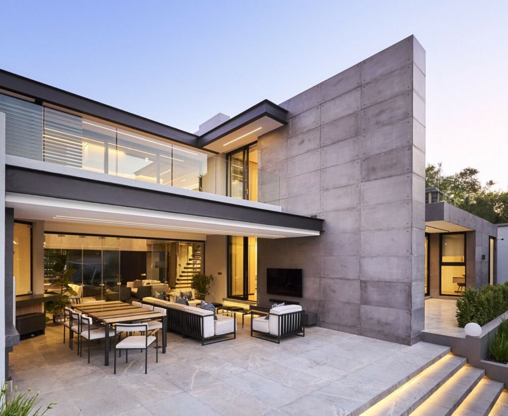 Contemporary house with spacious patio and well-designed landscaping.