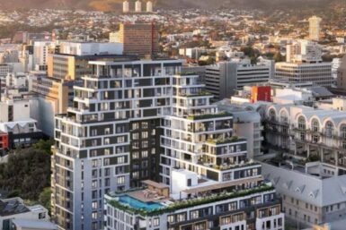 Aerial view of Cape Town, South Africa showcasing the cityscape, ocean, and Table Mountain in the background.