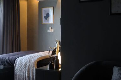 Stylish Dark bedroom In Lagos by Interiors with Tega