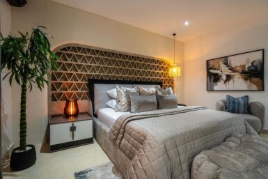 Dynamic feature wall behind bedframe in bedroom by dwellion design.