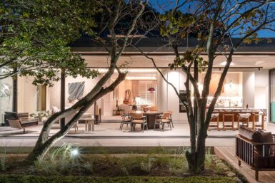 Outdoor dining area by swimming pool.