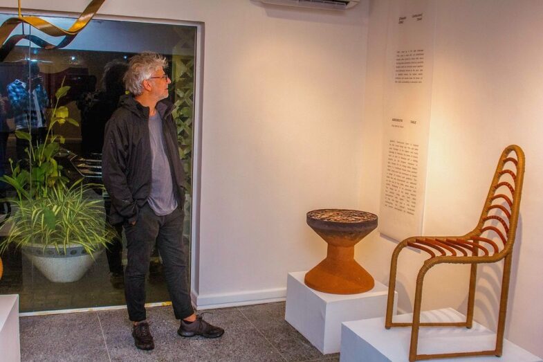 Man admiring art exhibition at Design intersect 2024