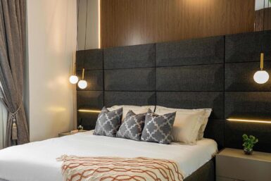 Statement headboard with sleek sidetable.